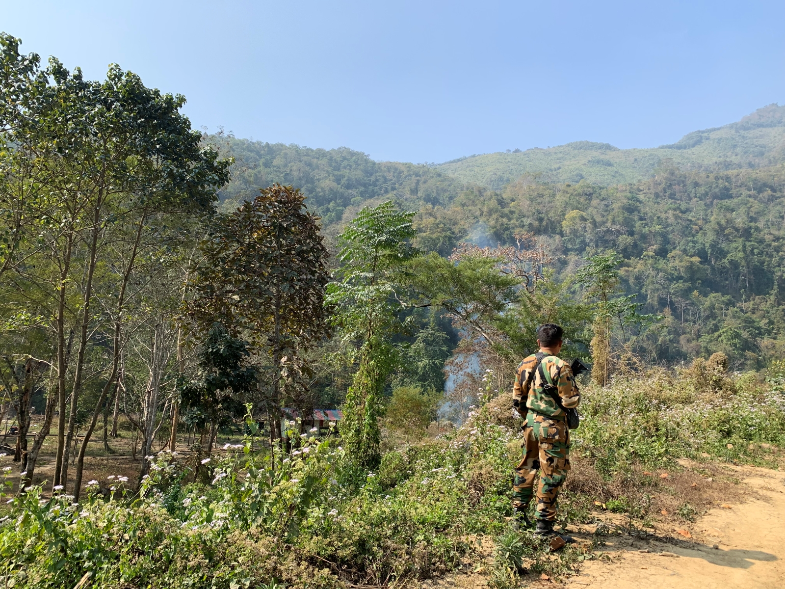 A Chin National Defence Force fighter guards the perimeter of the group’s headquarters in Chin State’s Falam Township on January 16, 2023. (Karishma Hasnat | Frontier)