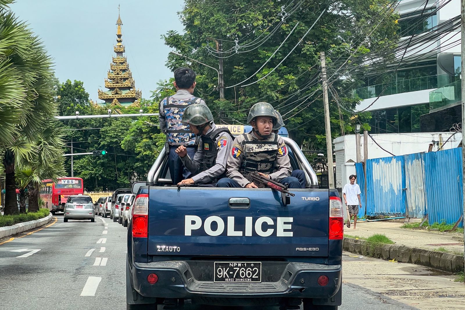 Junta police patrol a street in Yangon on July 19, 2023. (AFP)