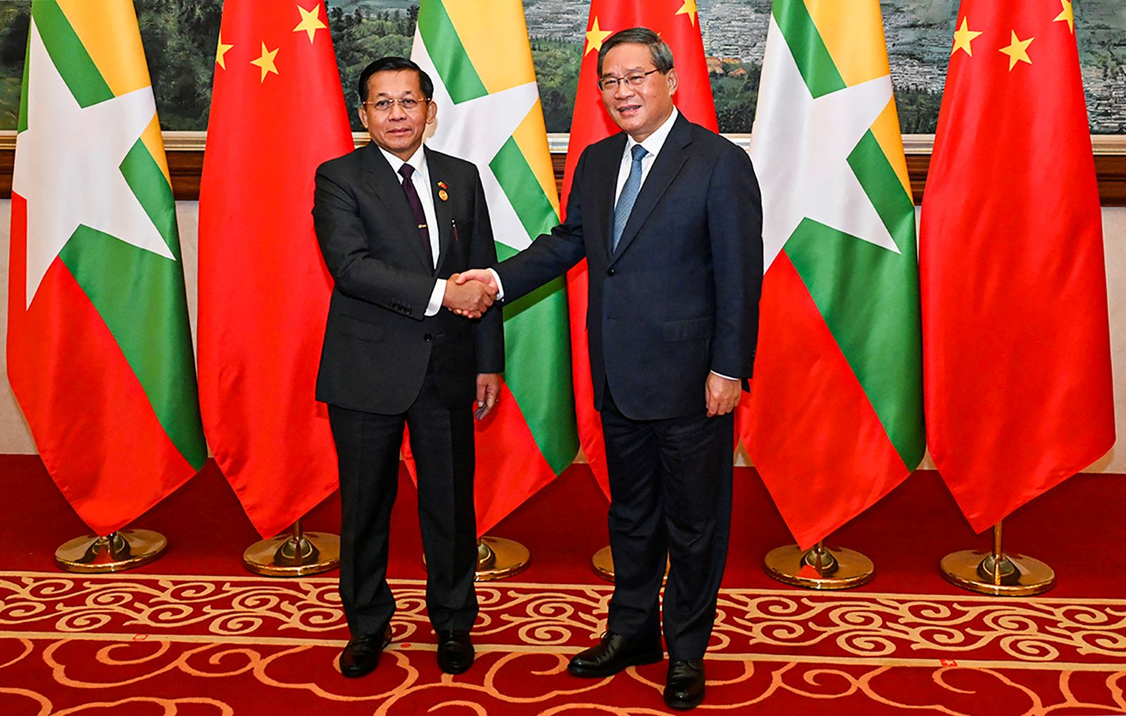 Junta chief Senior General Min Aung Hlaing shakes hands with China's Premier Li Qiang during the Greater Mekong Subregion Summit in the Chinese city of Kunming on November 6, 2024. (AFP)