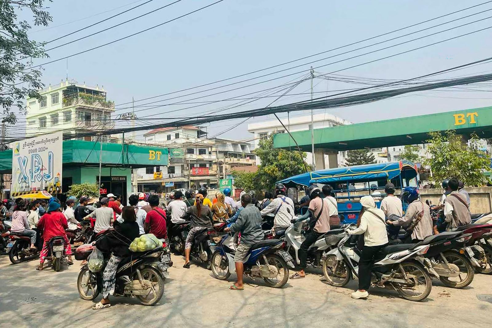 Motorists queue at a petrol station in the eastern Shan State border town of Tachileik on March 4. (AFP)