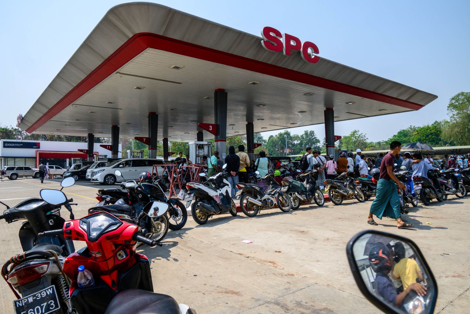 Motorists queue to refuel their vehicles at a petrol station in Nay Pyi Taw on March 29. (AFP)