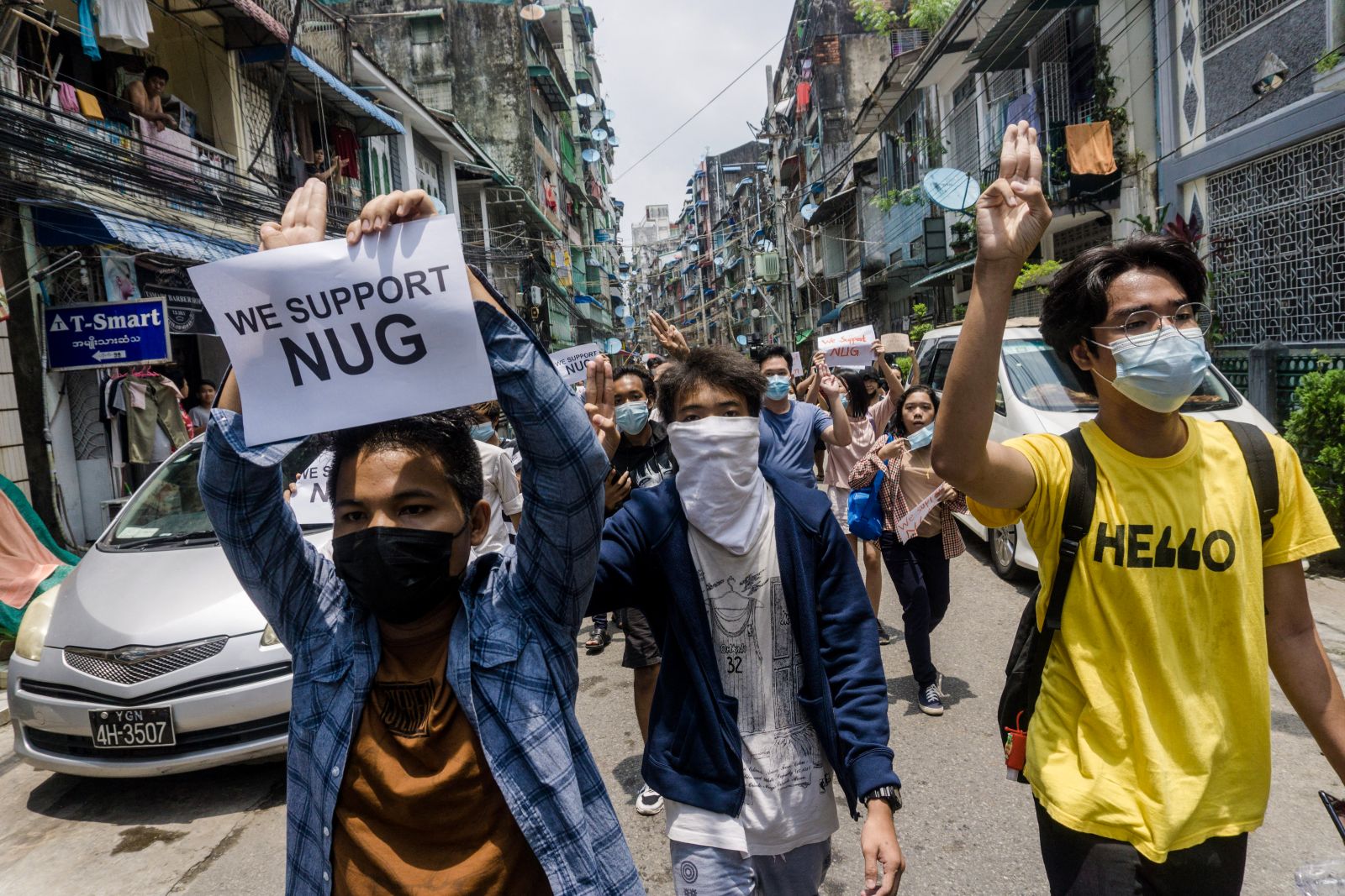 A protester holds a sign supporting the National Unity Government during a demonstration against the coup in Yangon on April 27, 2021. (AFP)