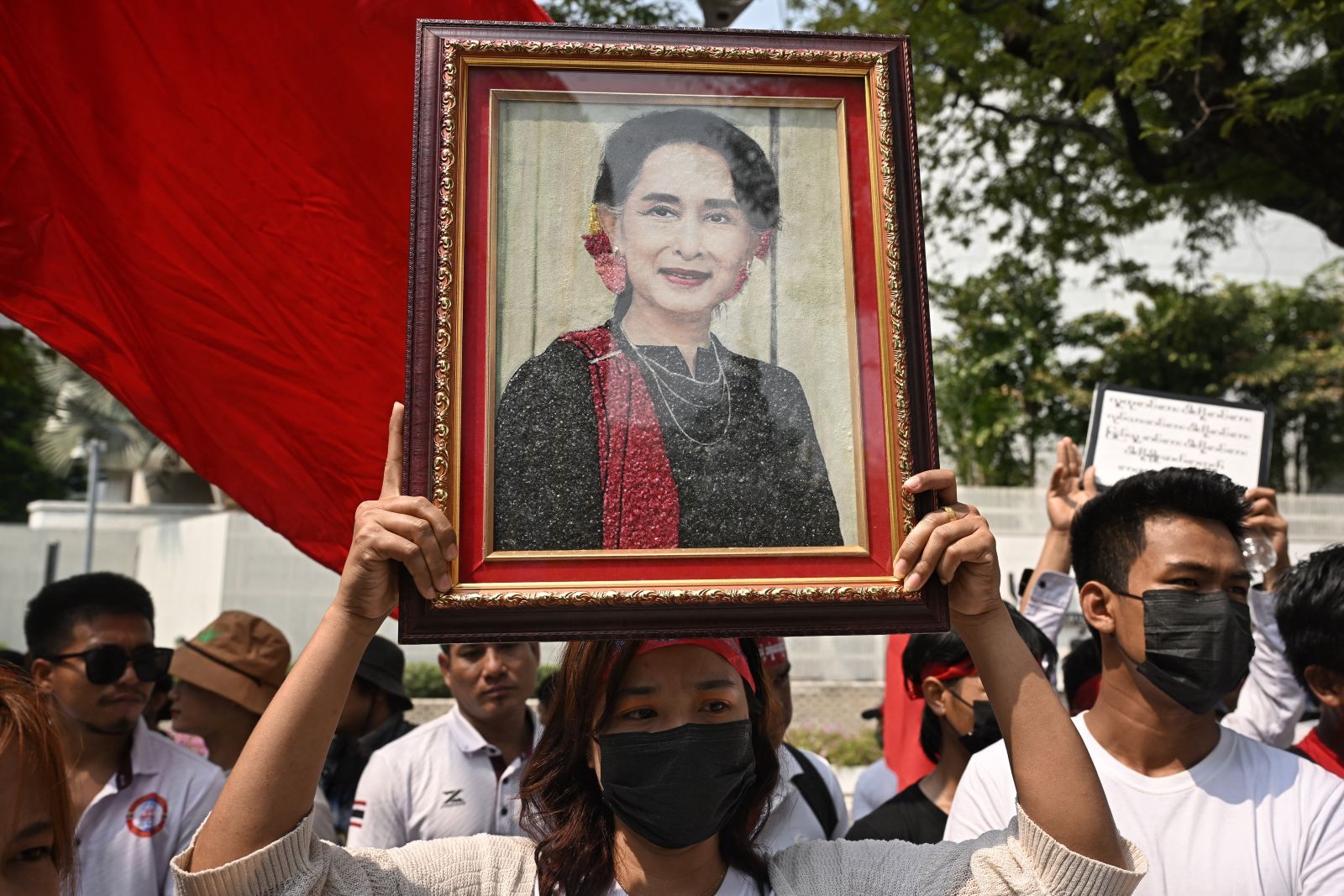 Protesters hold an image of detained Myanmar leader Aung San Suu Kyi during a demonstration outside the United Nations office in Bangkok on February 1, 2024. (AFP)