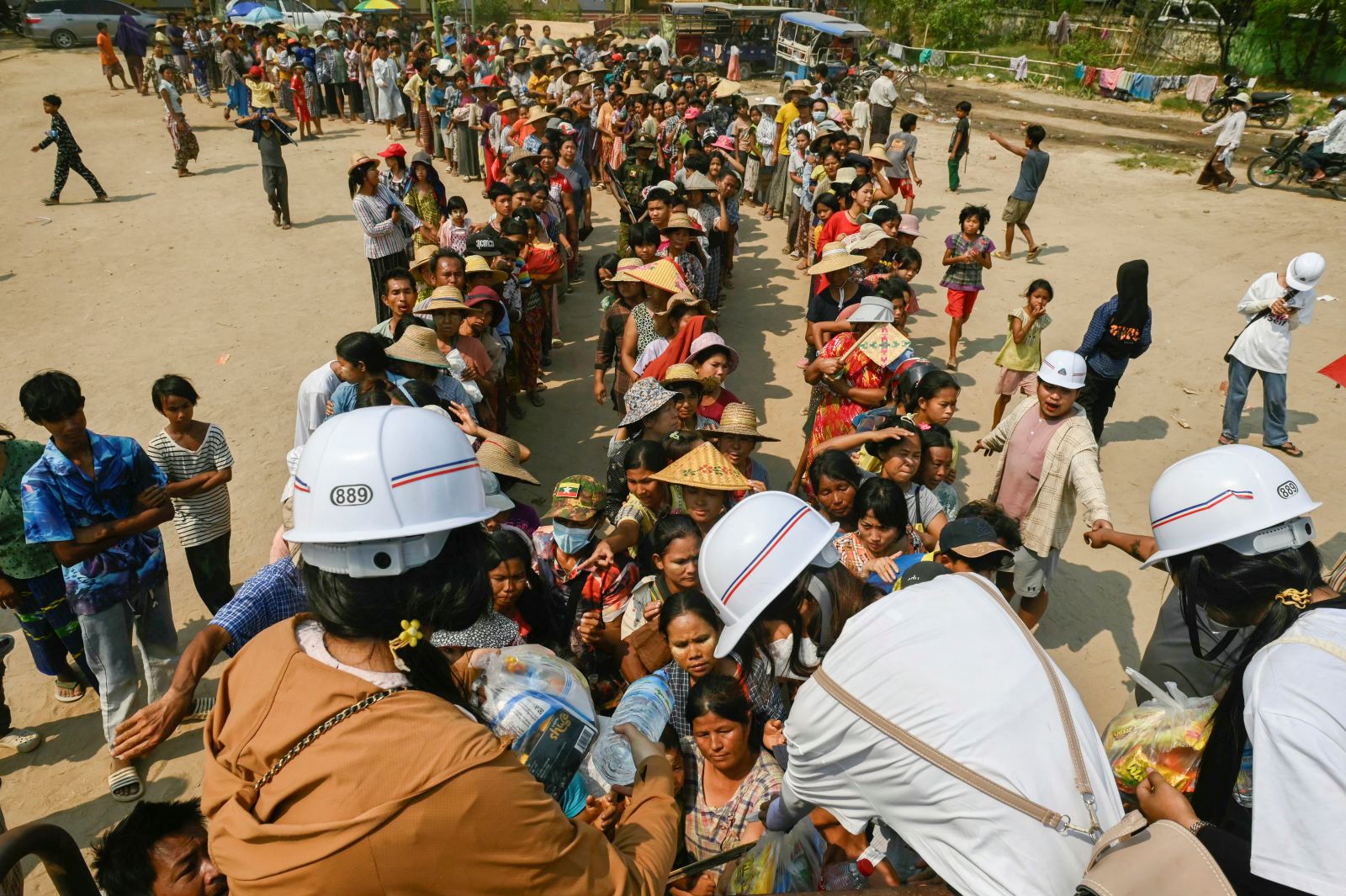 A local aid organisation distributes food in Sagaing Township on April 3 last year, following the March 28 earthquake. (AFP)