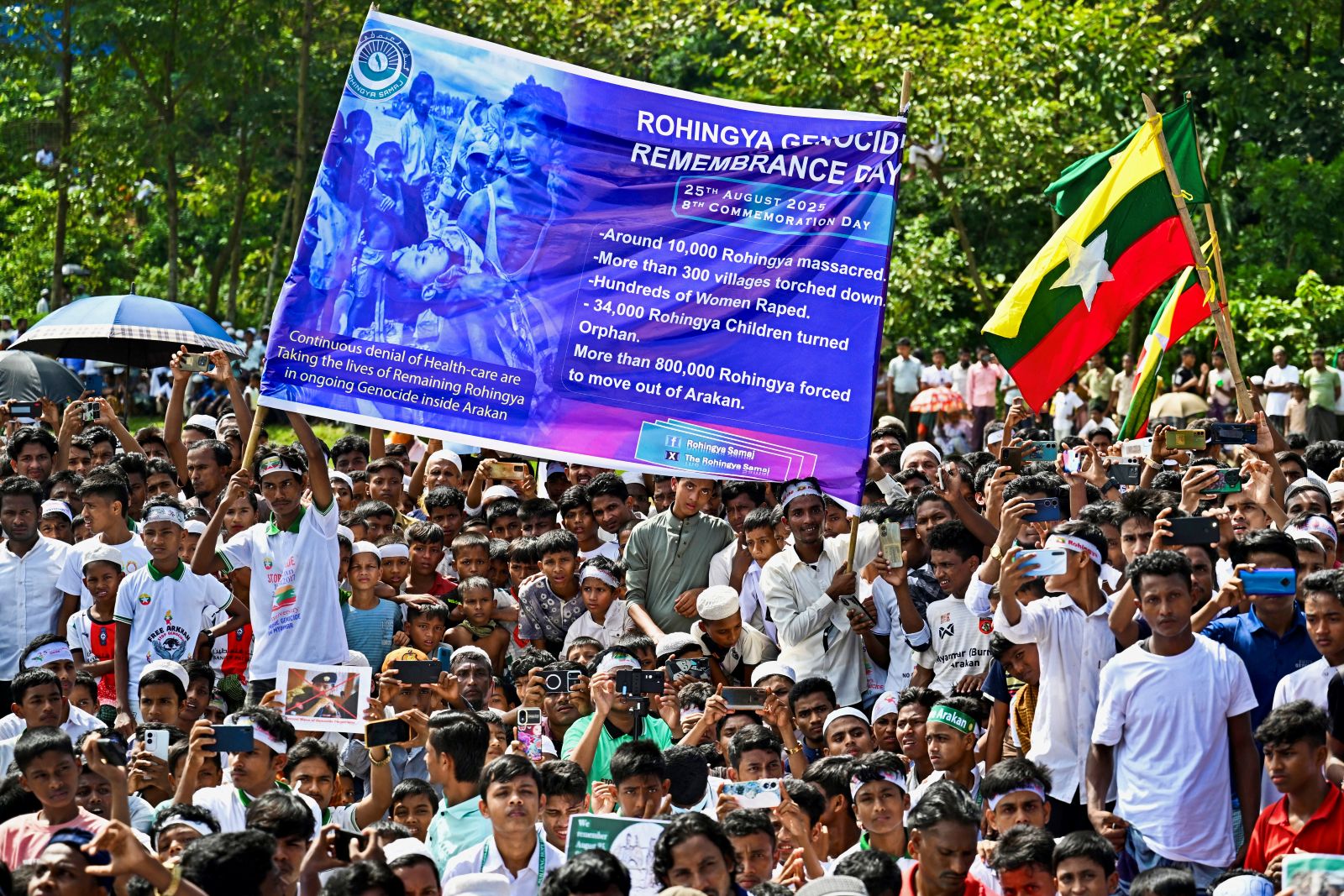 Rohingya refugees take part in the “Genocide Remembrance Day” rally to mark the anniversary of their mass exodus from Myanmar during a military crackdown, at a refugee camp in Banfgladesh's Cox’s Bazar district on August 25, 2025. (AFP)