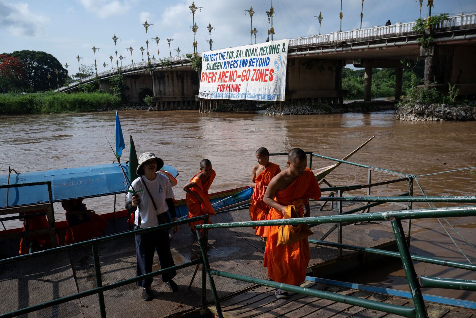 Buddhist monks take part in a flotilla protesting river pollution caused by mining in Myanmar, near the the northern Thai city of Chiang Rai, on June 5. (AFP)