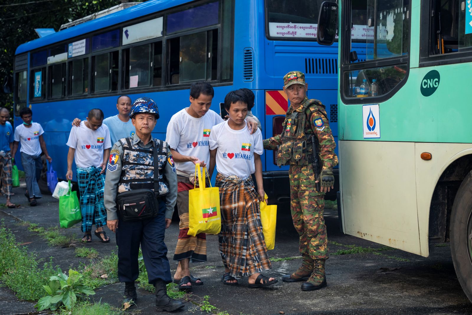 Myanmar migrants repatriated from Malaysia arrive at a temple in Yangon Region’s Thanlyin Township on October 4. (AFP)
