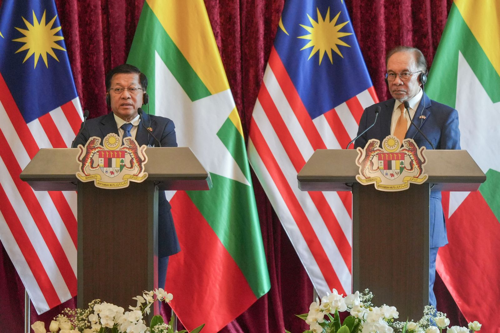 Myanmar regime’s president Min Aung Hlaing speaks as Malaysia’s Prime Minister Anwar Ibrahim listens during a press conference in Putrajaya on October 8. (AFP)